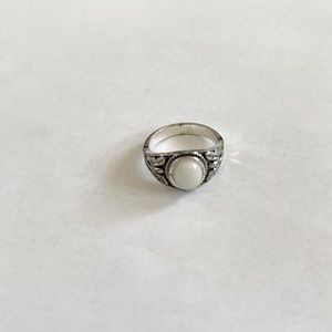 Ring with white gem